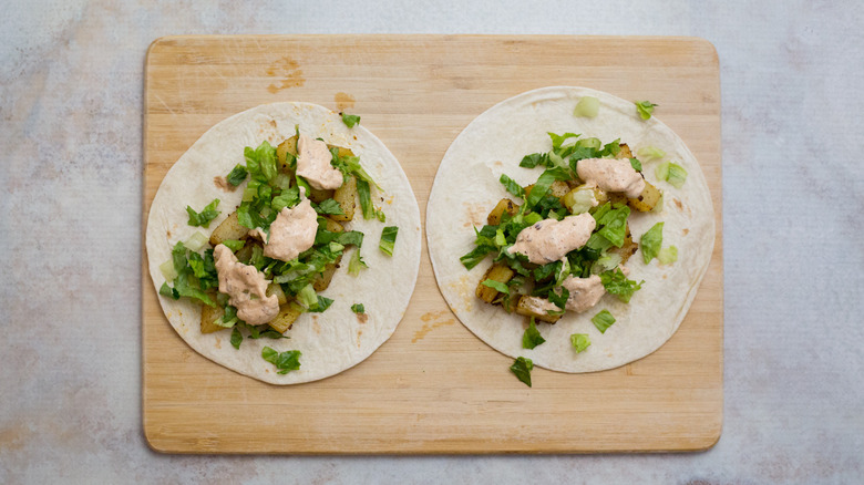 potato tacos on cutting board