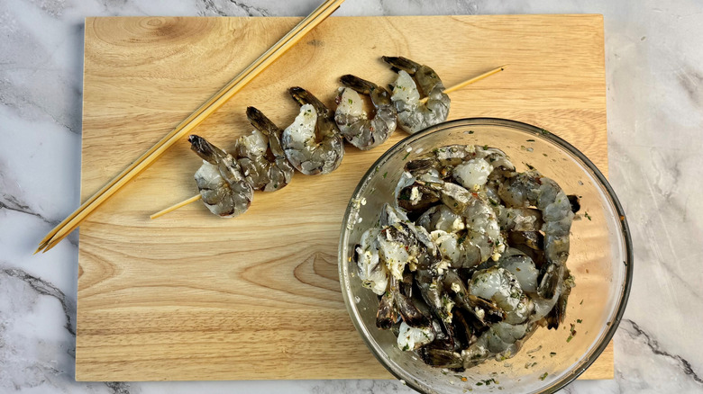 shrimp in bowl and some on skewer