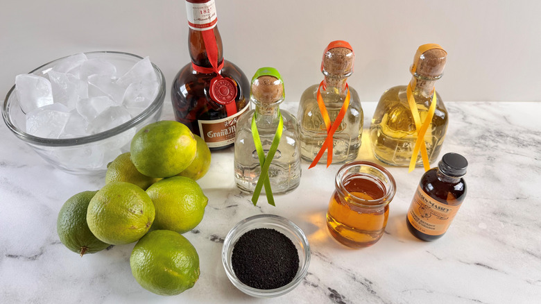 limes with ice, tequila, Grand Marnier, and assorted other liquids