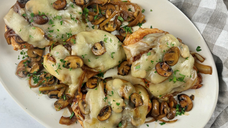 Copycat Texas Roadhouse smothered chicken on serving platter