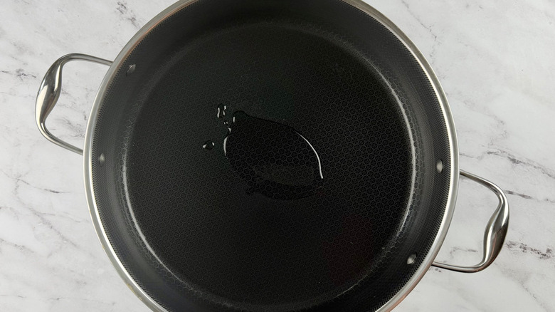 Drizzle of oil in pan
