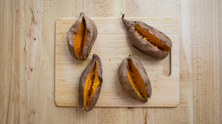 baked sweet potatoes on board