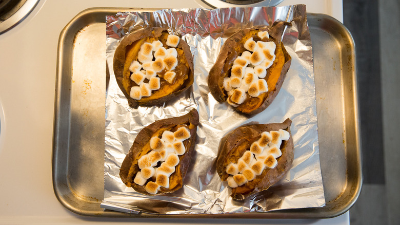 loaded sweet potatoes on pan
