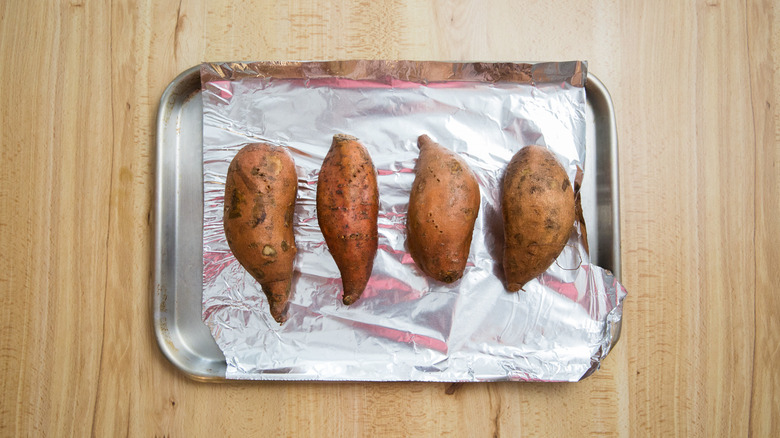 sweet potatoes on baking pan