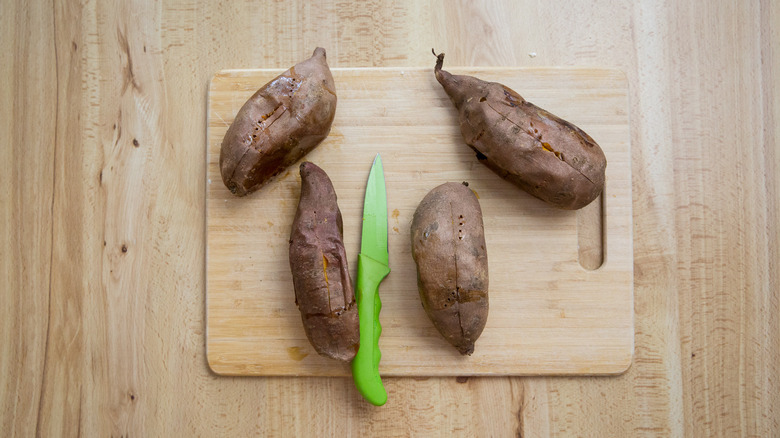 baked sweet potatoes on board