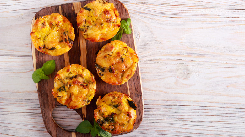 mini frittatas on wooden cutting board