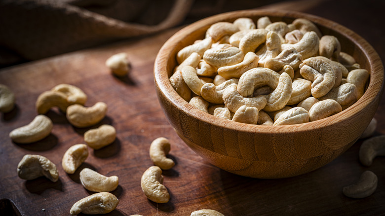 wooden bowl filled with cashews