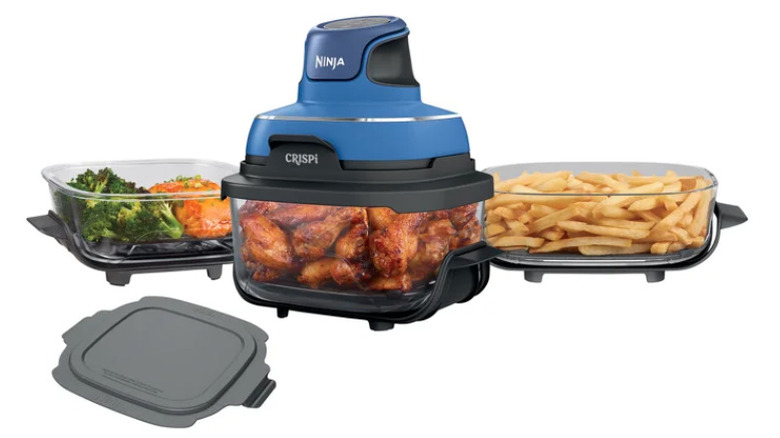 Air fryer with various containers of food