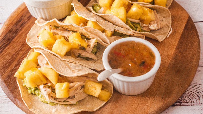 5-ingredient Costco copycat tacos on wooden board with salsa