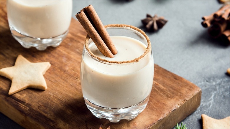 Eggnog glass with cinnamon stick spiced rim sugar cookies