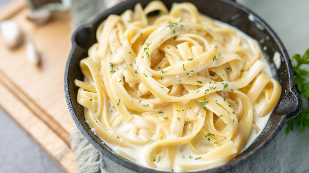 Skillet of fettuccine alfredo pasta