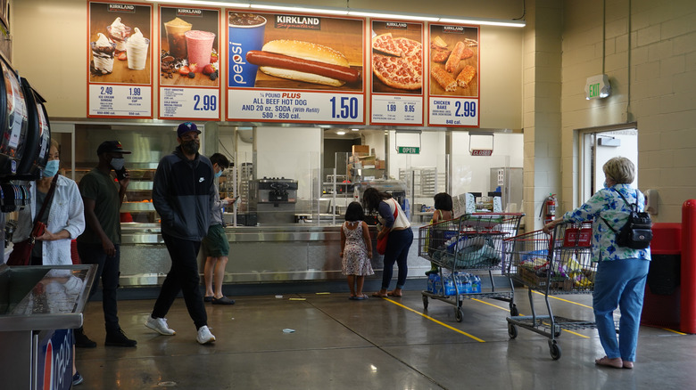 People ordering at the Costco food court