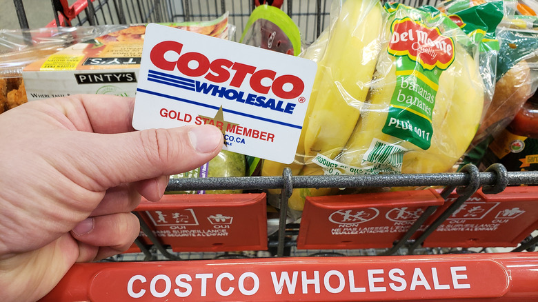 Shopper holding Costco card