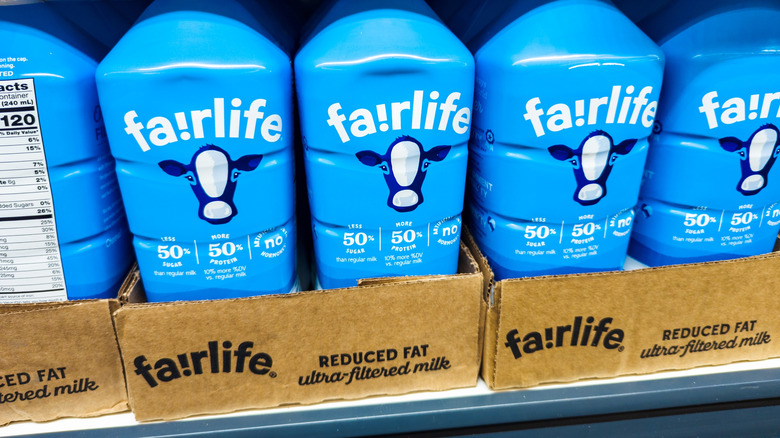 Fa!rlife milk bottles in carboard boxes on grocery store shelf