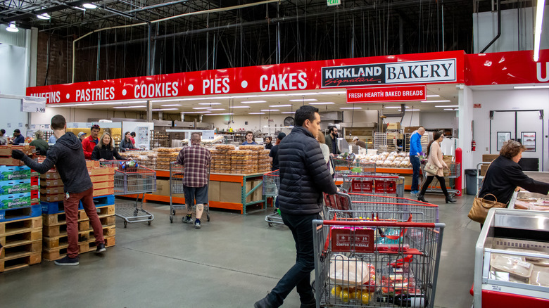 Customers shopping inside Costco's bakery department.