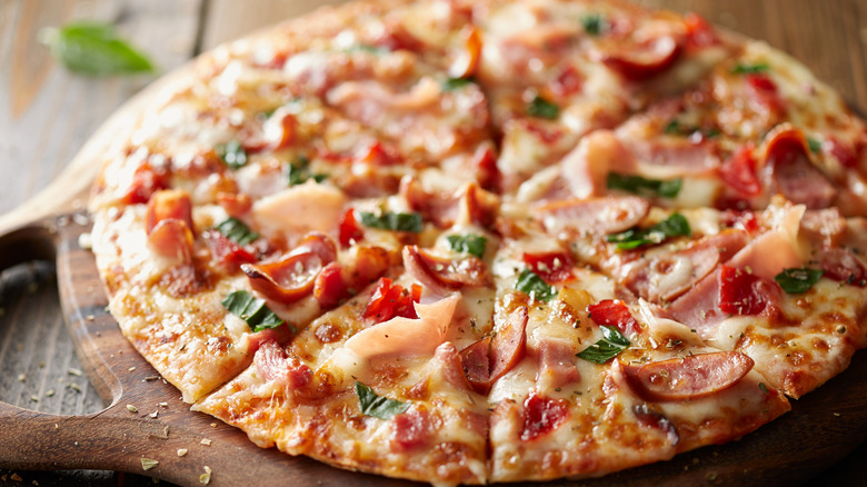 Pizza on wooden platter