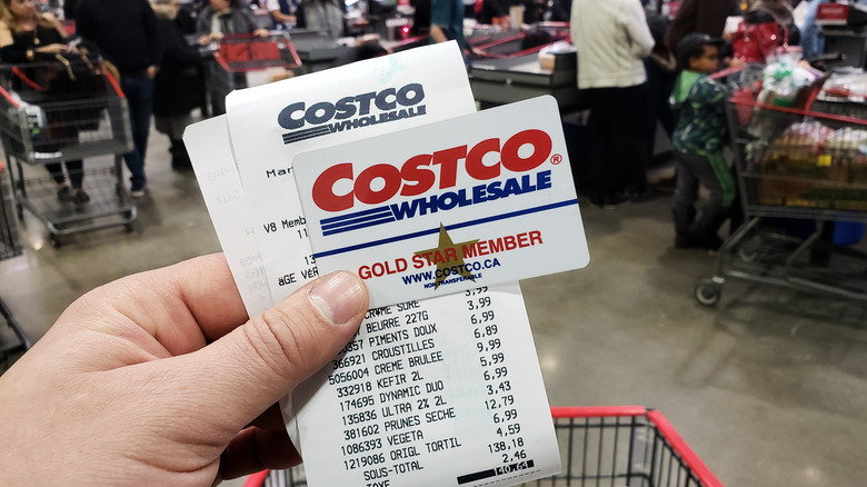Hand holding Costco card