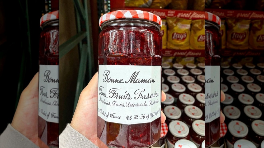 Person holding jar of Bonne Maman Four Fruits Preserves