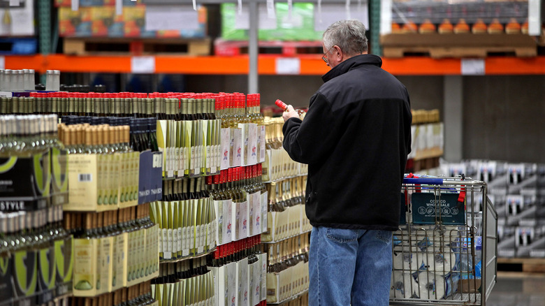 Shopper in Costco alcohol section