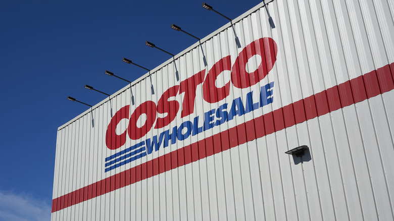 Costco sign against blue sky background