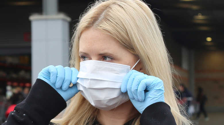 Woman with face mask outside Costco