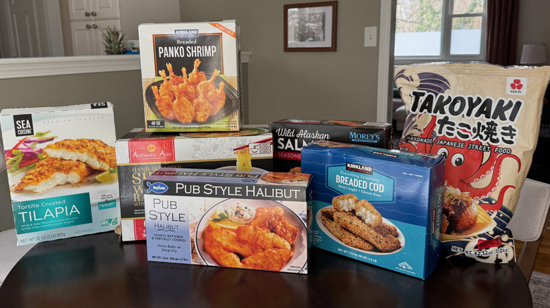 Various boxes of frozen seafood on table