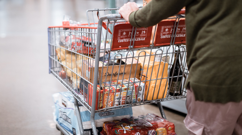 Costco shopper pushing grocery cart