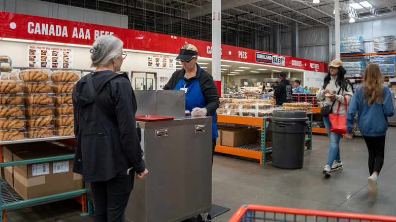 Costco with person handing out samples