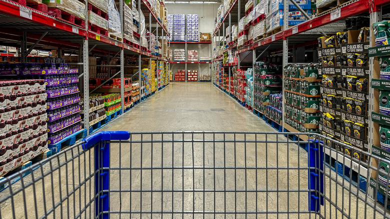 Shopping cart and empty aisle at Sam's Club
