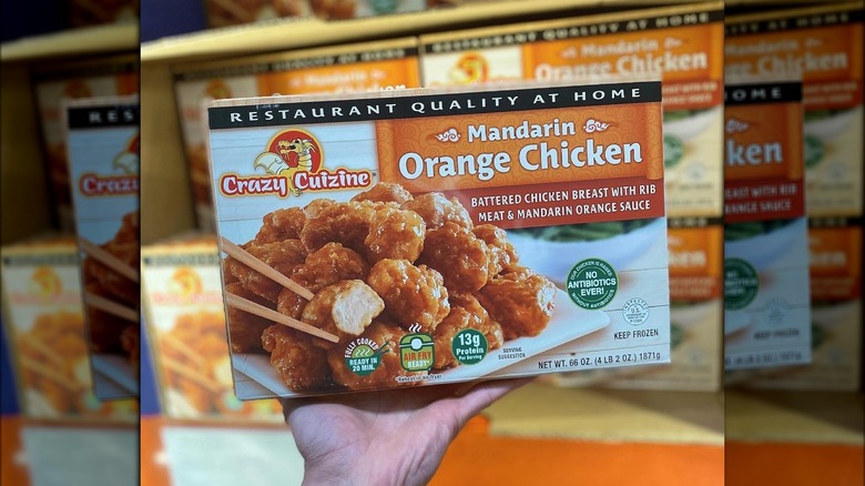 Hand holding Mandarin Orange Chicken from Costco