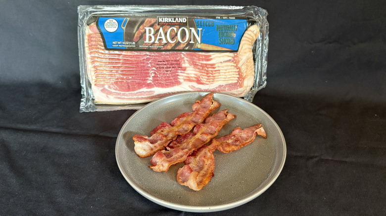 Kirkland bacon package behind plate of cooked bacon