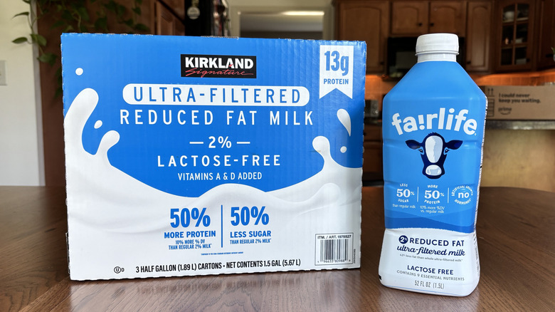 Box of Kirkland Signature ultra-filtered milk cartons and bottle of Fairlife ultra-filtered milk