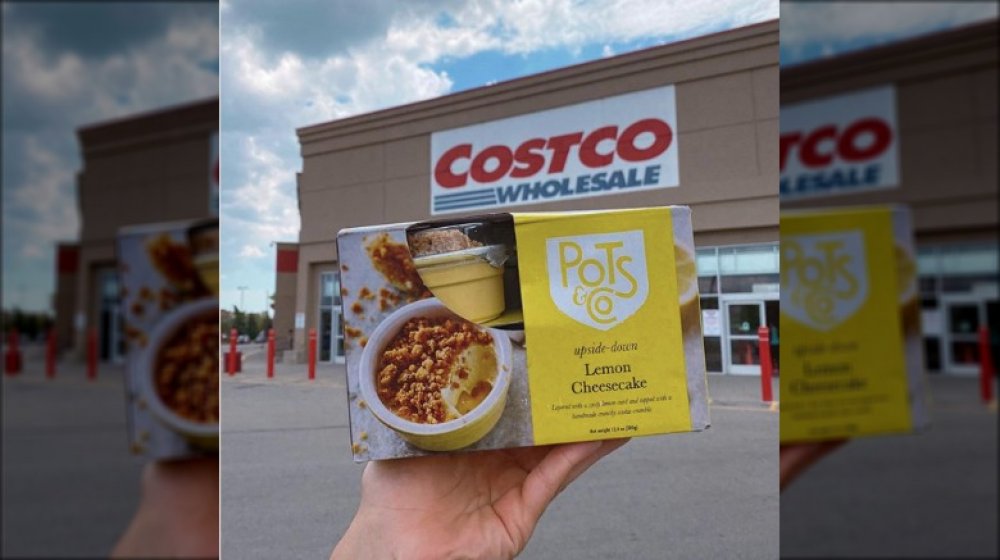 Hand holding a package of the new dessert outside Costco