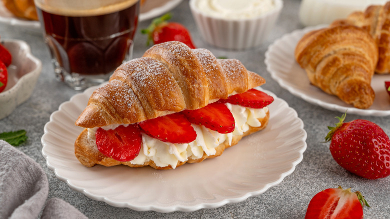 Croissant filled with strawberries and cream