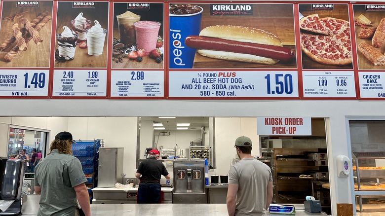 Costco food court sign and customers waiting