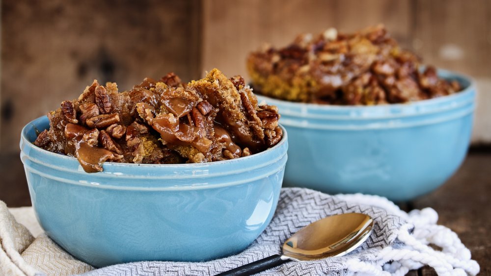 fall dessert with pecans and caramel in blue ceramic bowls
