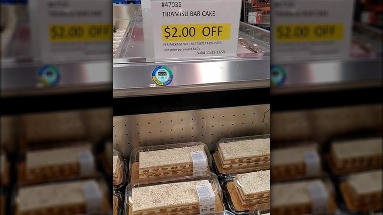 A display of tiramisu bar cake at Costco with a sale sign.