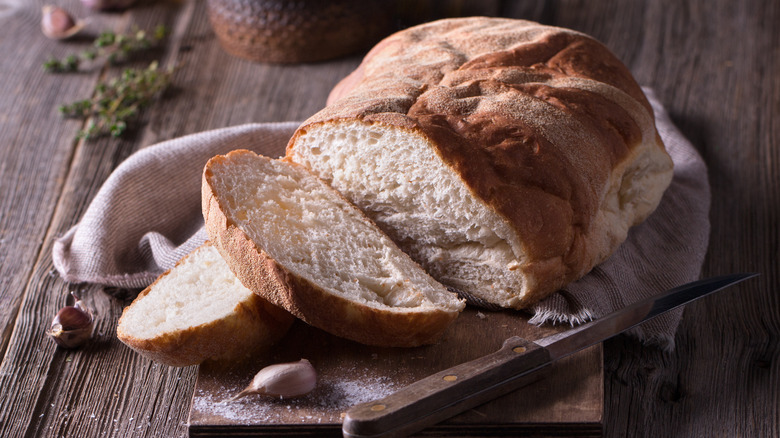 A sliced loaf of garlic bread