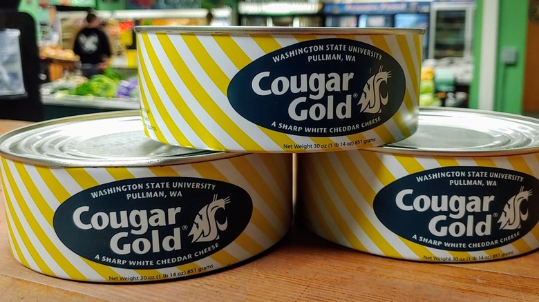 three cans of cougar gold cheese