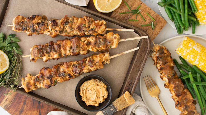 Chicken kabobs with cowboy butter on serving tray