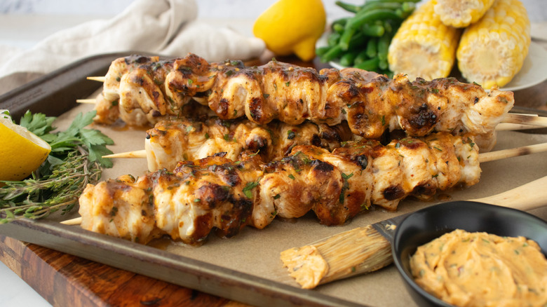 Chicken skewers with cowboy butter and corn