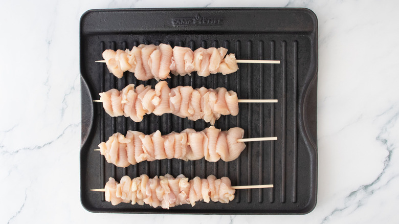 Chicken skewers on grill pan