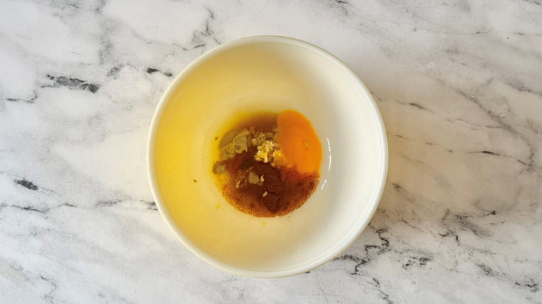Unmixed dressing ingredients in bowl
