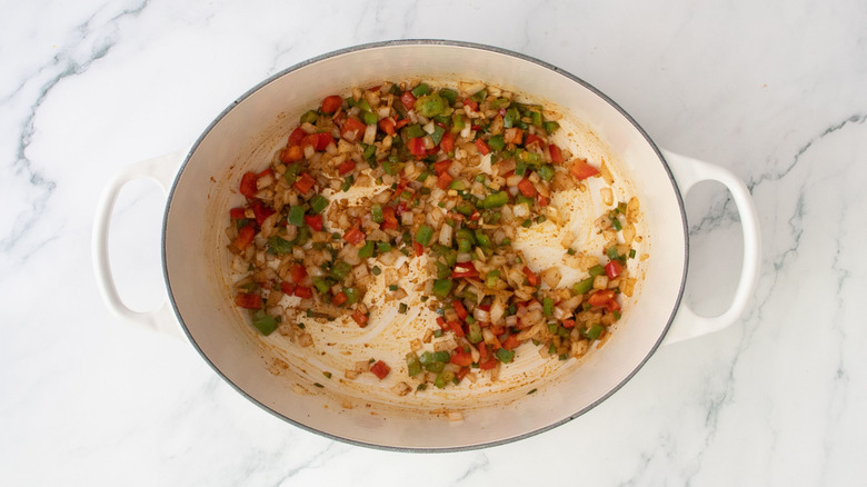 Seasoned diced veggies in Dutch oven