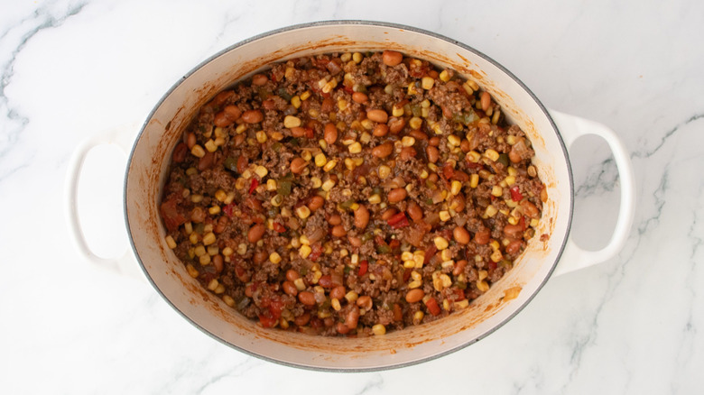 Beef and bean chili mixture in Dutch oven