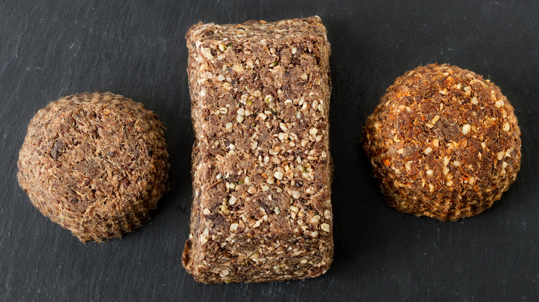 A bar flanked by two pucks of pemmican