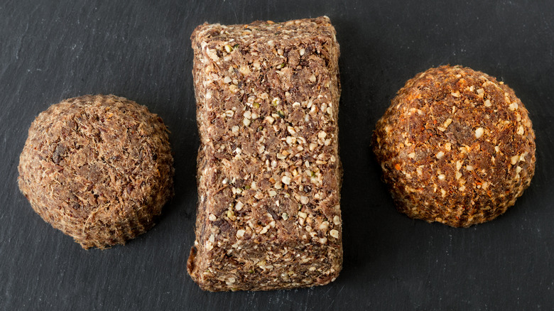 A bar flanked by two pucks of pemmican