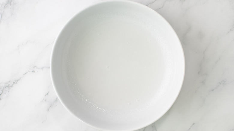 Water in white bowl