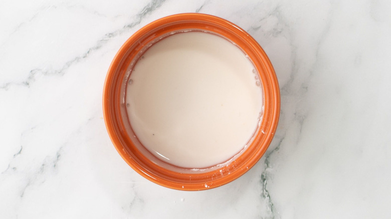 Cornstarch slurry in orange bowl