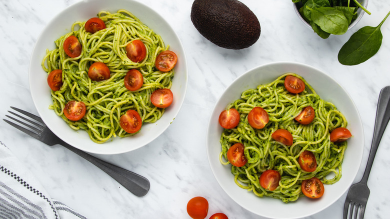 bowls of creamy avocado pasta 